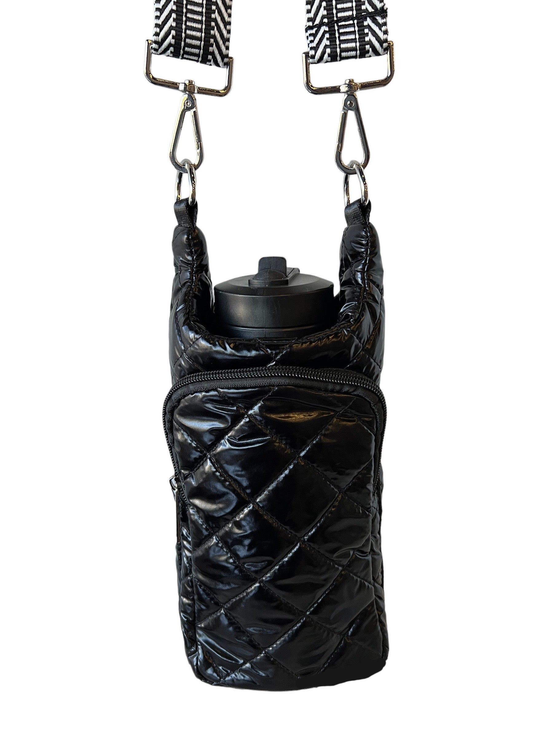 Chanel, black quilted leather bottle holder with its gol… | Drouot.com